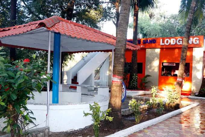 Lodging reception area among trees and garden paths